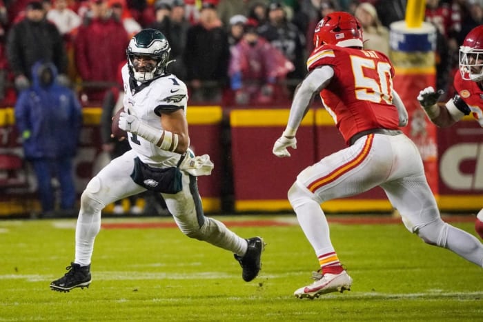 Nov 20, 2023; Kansas City, Missouri, USA; Philadelphia Eagles quarterback Jalen Hurts (1) runs the ball as Kansas City Chiefs linebacker Willie Gay (50) defends during the second half at GEHA Field at Arrowhead Stadium.